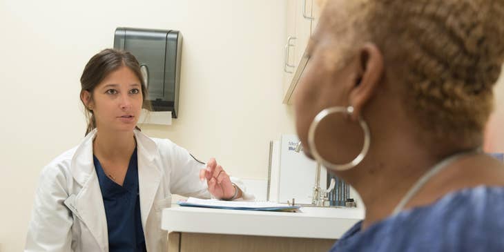Certified Diabetes Educator educates patient on self-management techniques.