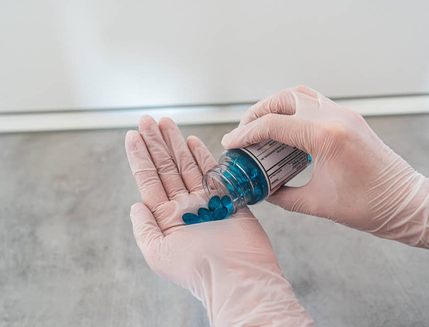 Certified Medication Aide administering prescribed medication as scheduled.