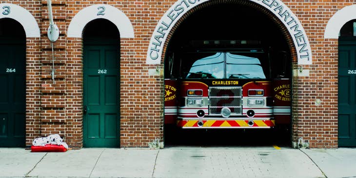 A building with a vehicle in Charleston, South Carolina.