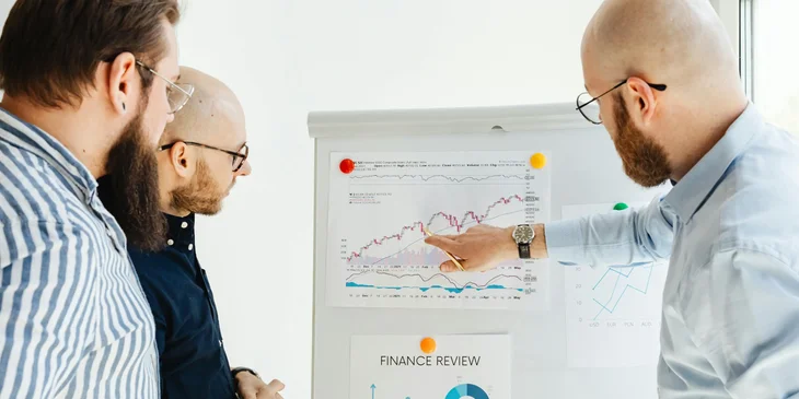 A chartered accountant preparing monthly financial reports with his team.
