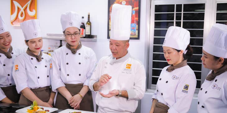 The chef provides training on food preparation.
