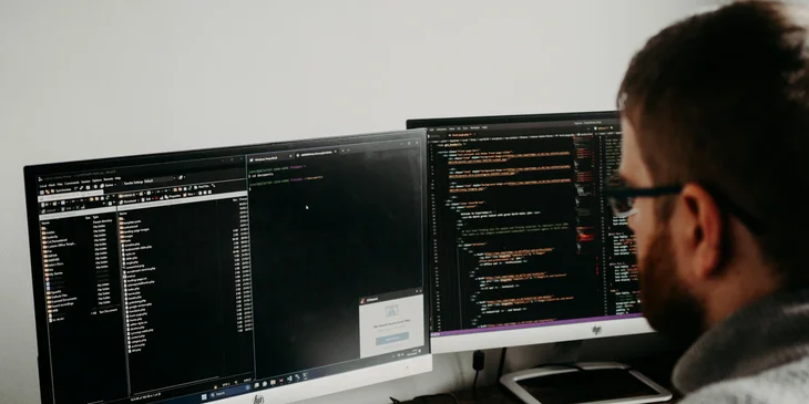 A chief information security officer working on computer coding.