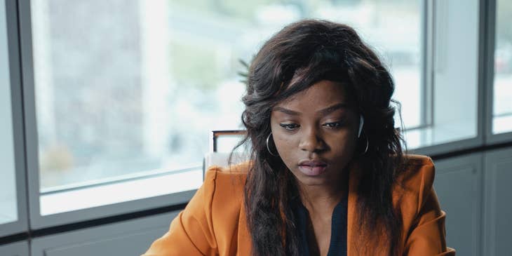 Chief Marketing Officer reviewing the campaigns submitted by her colleagues