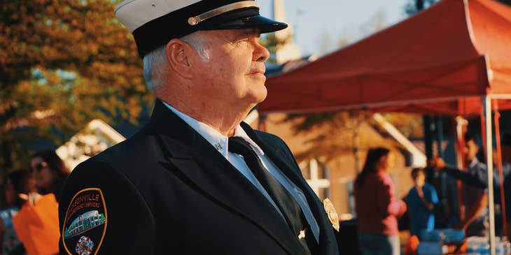 Chief of Police looks on the ongoing ceremony