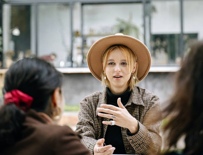 A chief talent officer discussing a project with two co-workers.