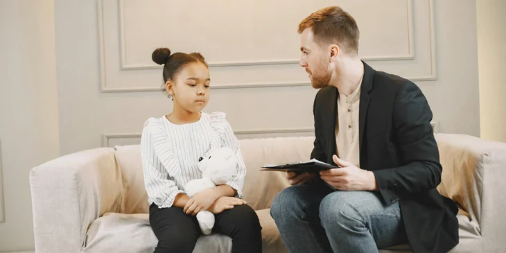 A child psychologist conducting psychological assessment.