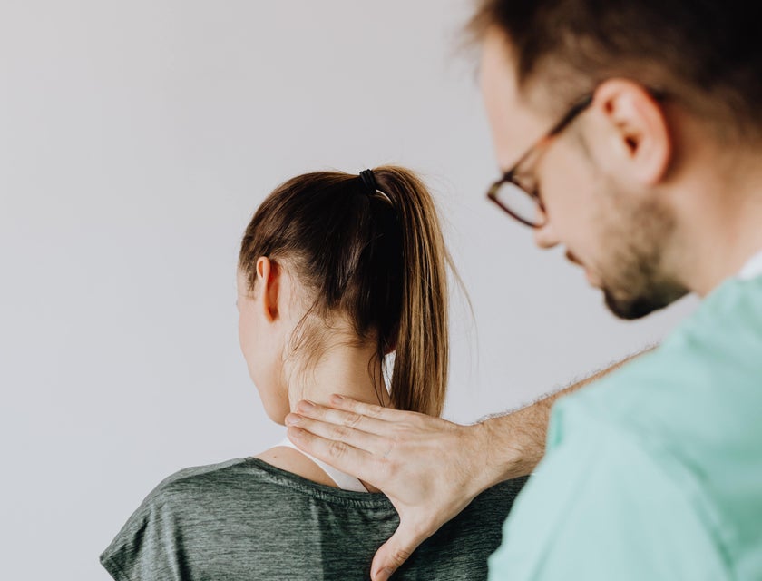 Chiropractor doing spinal manipulation to a patient.