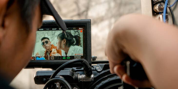 Cinematographer holding a camera