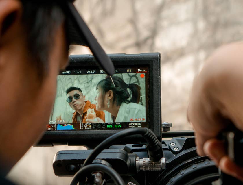 Cinematographer holding a camera