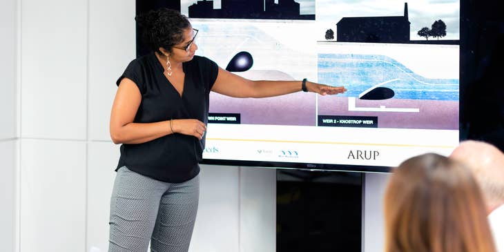 female Civil Engineer doing a presentation about a dam project