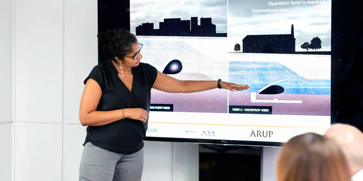 female Civil Engineer doing a presentation about a dam project