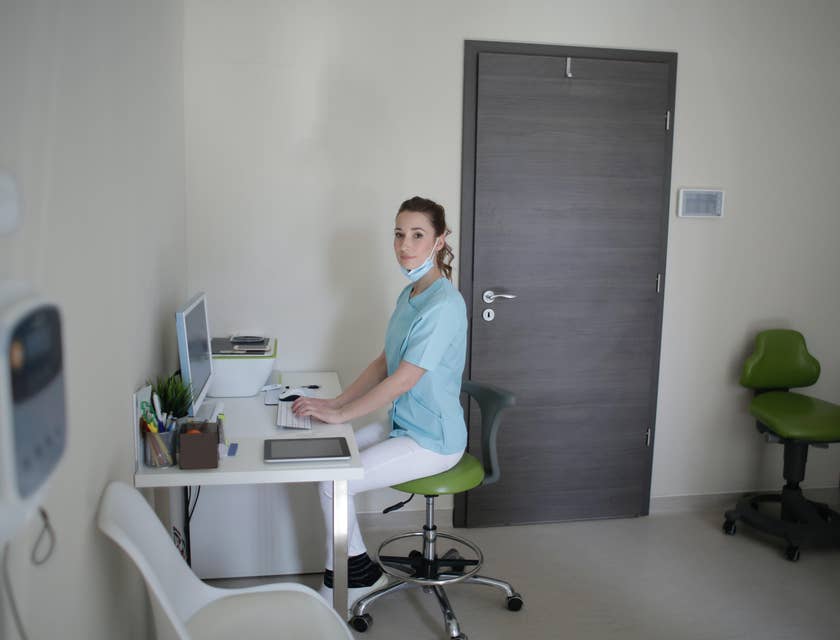 Clinical Director typing on a computer