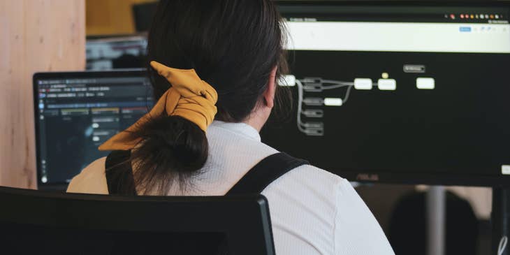Cloud Architect designing a system on her workstation for a new project