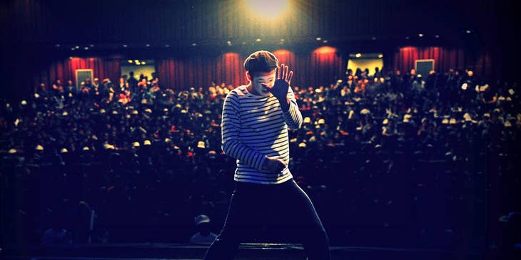 Comedian who specializes in miming performing in front of a crowd