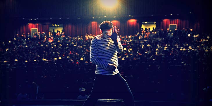 Comedian who specializes in miming performing in front of a crowd