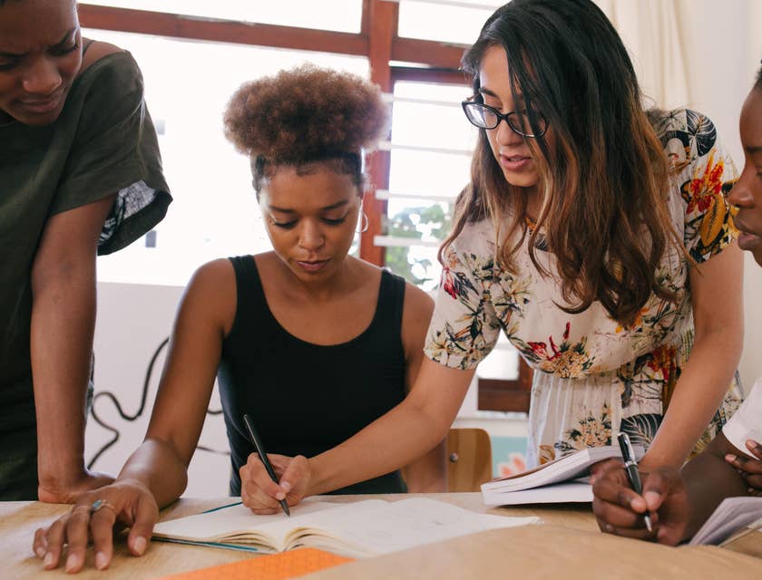Communications Manager preparing marketing materials with her colleagues