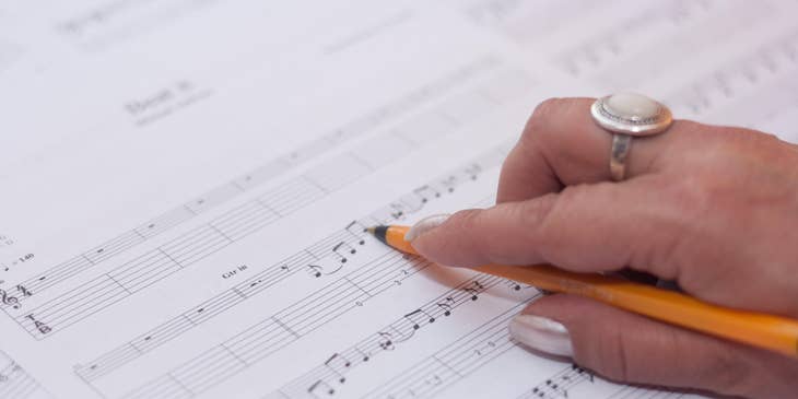 Composer holding a pen