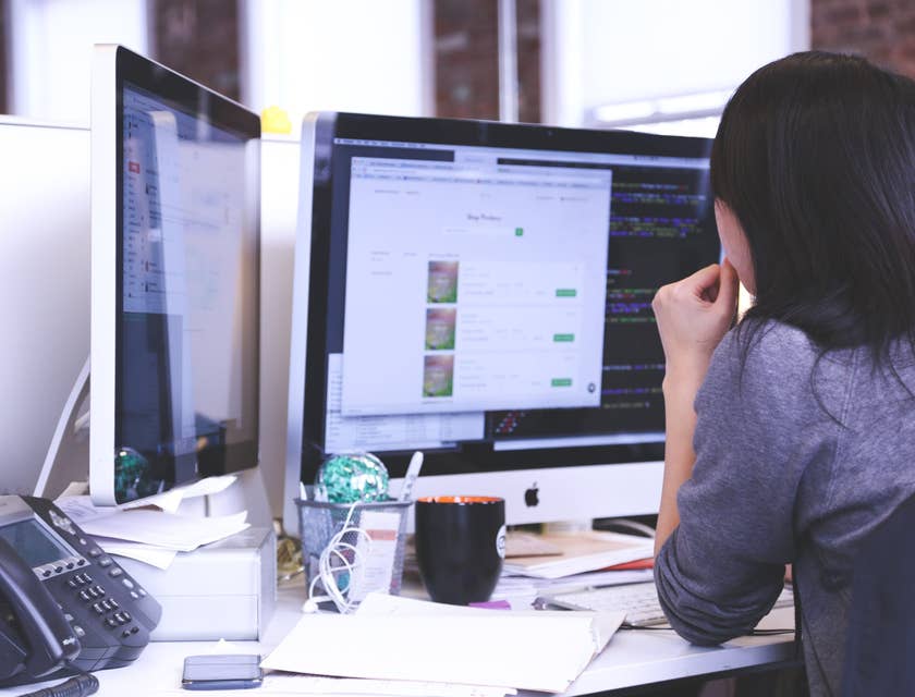 Computer Engineer working on a new software system and looking at her screen