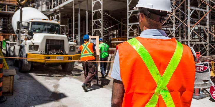 Concrete Foreman on his way to supervise concrete laborers.