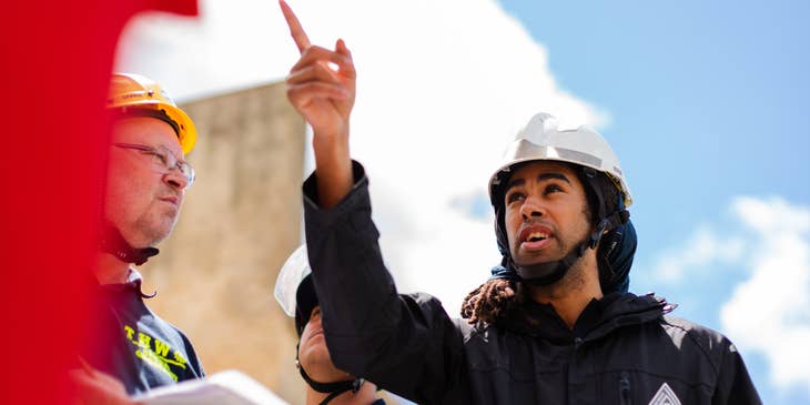 Construction Inspector with construction team inspecting building structure.