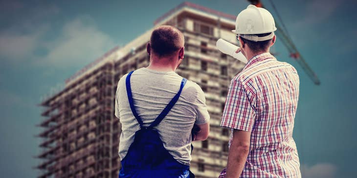 Construction Supervisor discussing with one of his crew members..