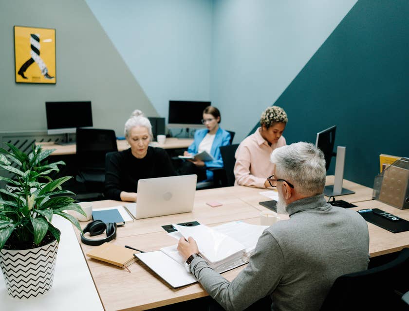 A Contract Administrator collaborating with the management team to ensure compliancy.