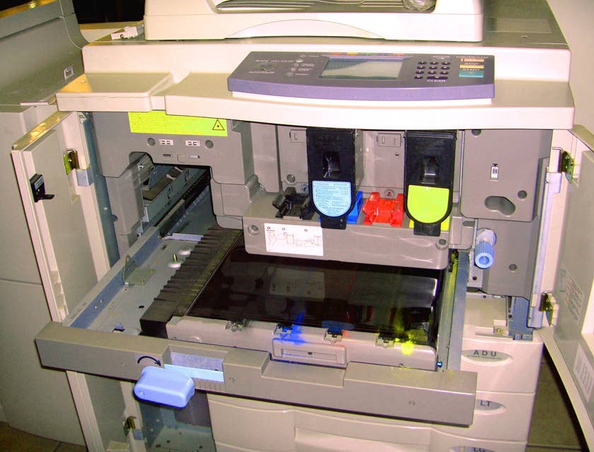 a copier opened to show its inside mechanisms
