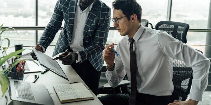 Corporate Controller analyzing income statements.