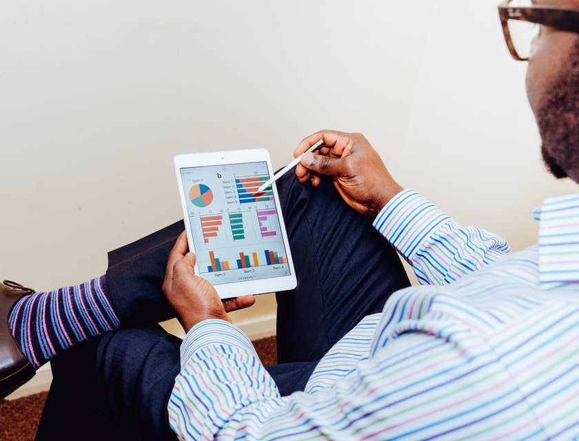 Cost Analyst looking at a graph report through his tablet
