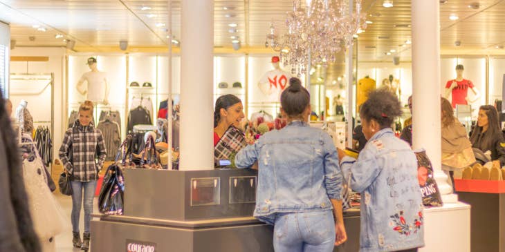 Counter Sales Personnel processing the payment of the customers