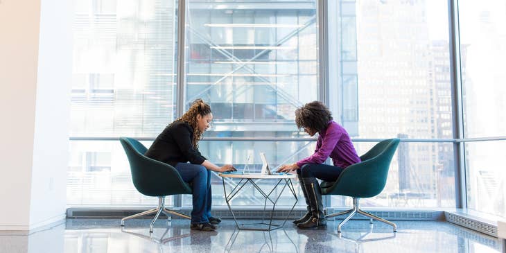 Creative Consultant on a meeting with a client showing her some of the good campaigns for her business