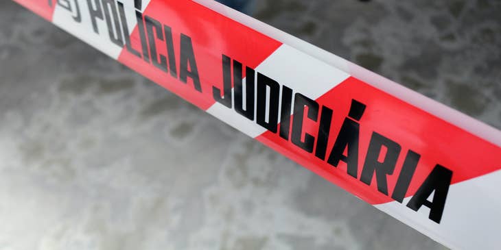 A Crime Scene Investigator standing in a crime scene about to collect evidences and transport them to the laboratory for analysis.