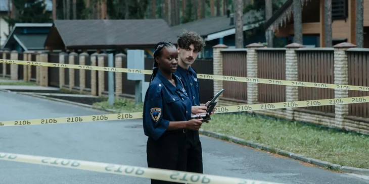 The crime scene investigators standing in a crime scene about to collect evidences and transport them to a laboratory for analysis.