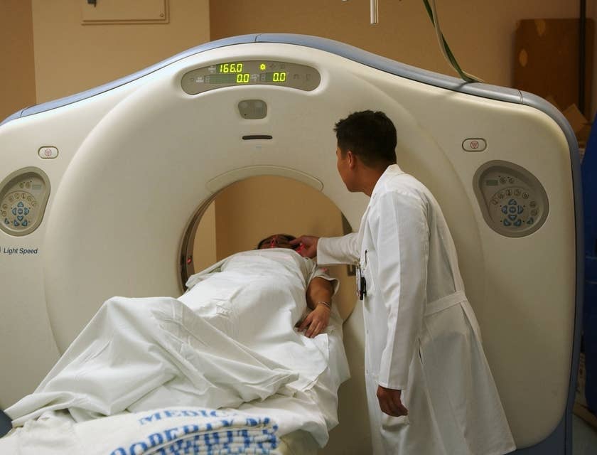 CT Technologist positioning the patient to scan specific areas of their bodies.