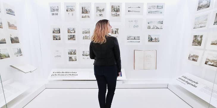 Curator looking at her display design  and checking out if it can be better.