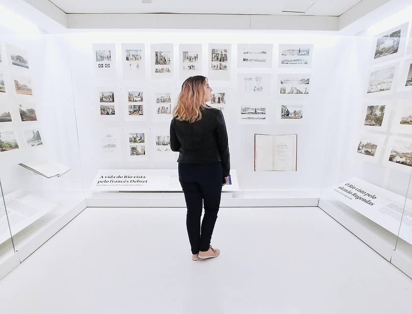 Curator looking at her display design  and checking out if it can be better.