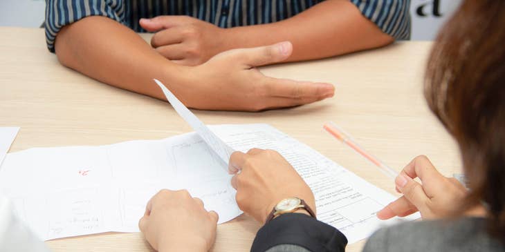 People reading a document or resume