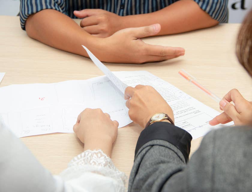 People reading a document or resume