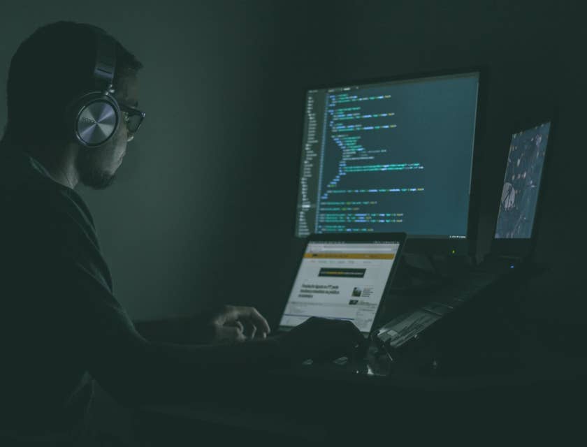 Cyber Security Engineer sitting at his workstation and monitoring the results of penetration tests to the system