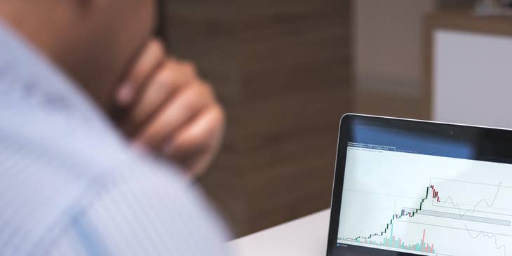 Data scientist working at a desk with a laptop.