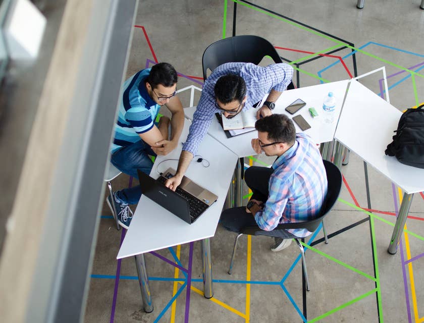 a team of Database Engineers deliberating on the database performance and planning to enhance its design