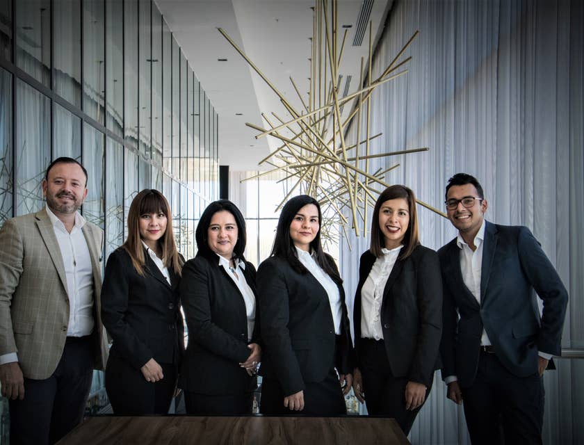 photo of the debt collector team wearing business attire taken on an office hallway