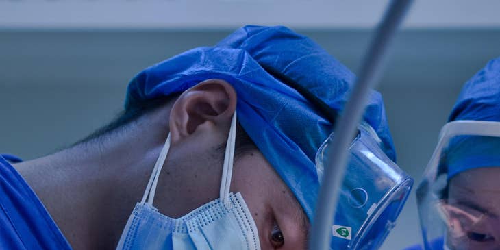 Man conducting dental surgery