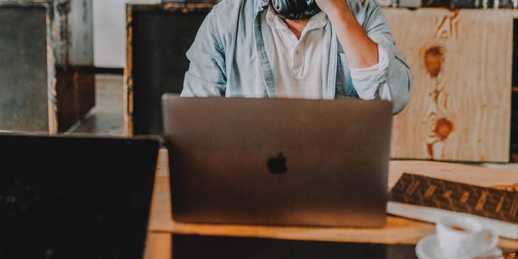 Digital Marketing Assistant taking a call in the middle of conducting a market research