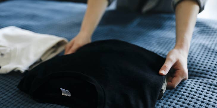 Direct Care Worker prepares the client's clothes before going on a trip.