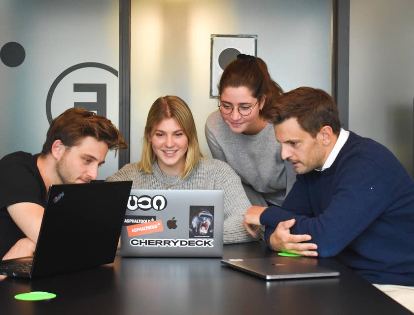Female Director of Marketing showing the new campaign to her team inside the conference room