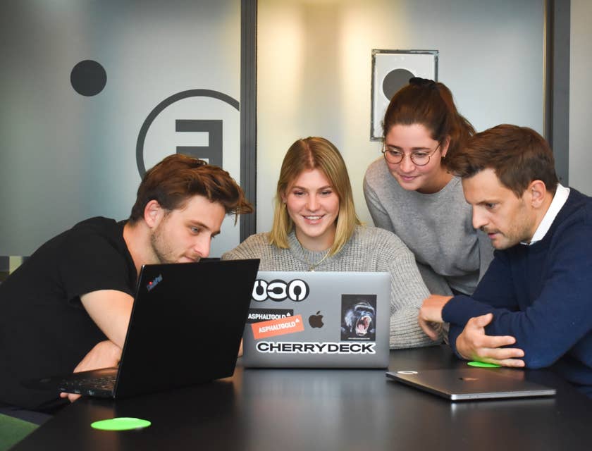 Female Director of Marketing showing the new campaign to her team inside the conference room