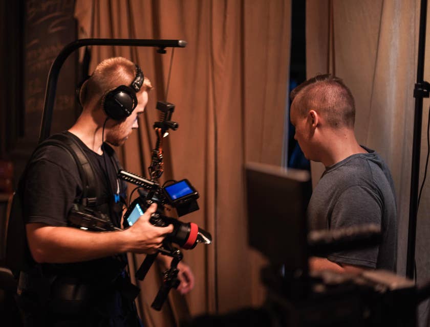 Director of Photography giving instructions to the cameraman for the best on where to position