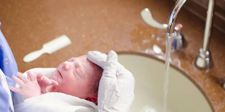 Doula bathing assists in bathing a baby while the mother heals.