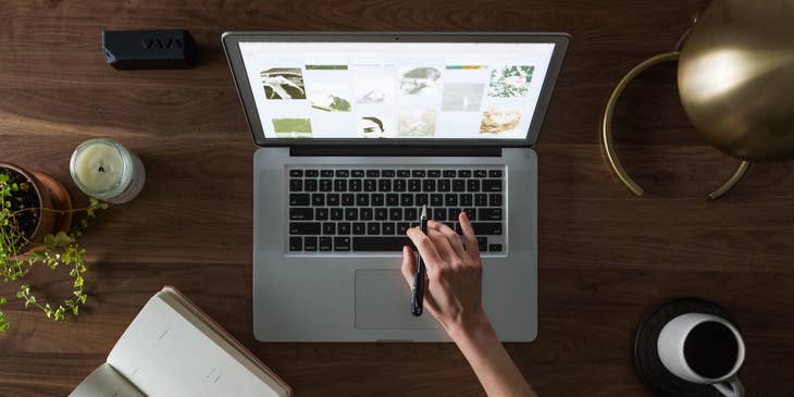 E-Commerce Associate checking the photos on the website if it's up to date and relevant to the current trend